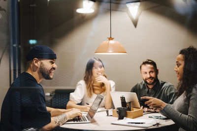 Coworkers having meeting in office