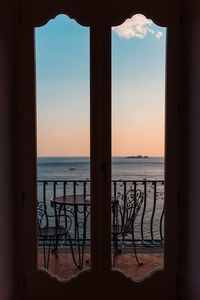 Scenic view of sea seen through window