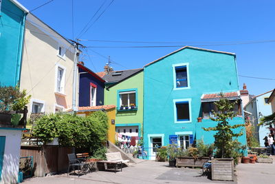 Houses in a colorful village near nantes against clear blue sky