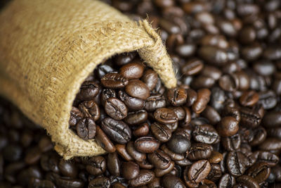 Close-up of roasted coffee beans with burlap