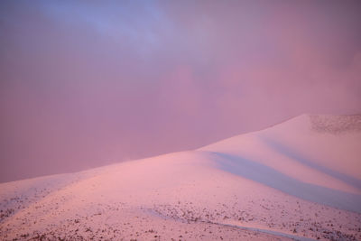 Scenic view of mountain against sky during sunset