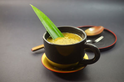 Close-up of coffee cup on table