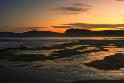 Scenic view of landscape at sunset