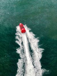 High angle view of sailboat sailing in sea