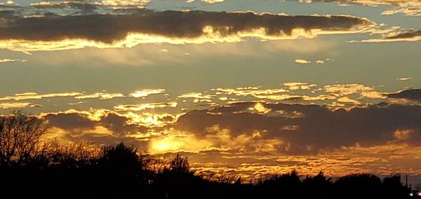 Scenic view of dramatic sky during sunset