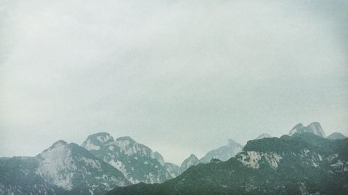 Scenic view of mountains against sky during winter