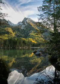 Scenic view of lake and mountains against sky