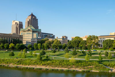 View of buildings in city against clear sky