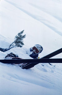 People skiing on snow covered mountain