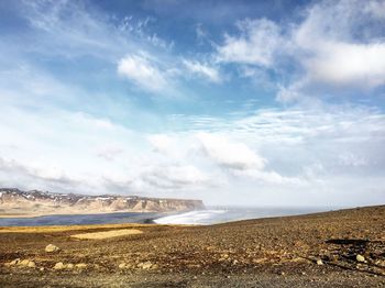 Scenic view of sea against cloudy sky