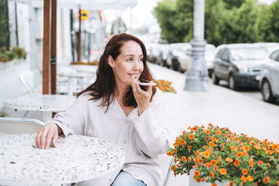 Young woman using mobile phone