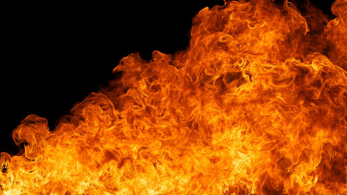 Close-up of fire against black background