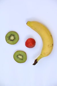 Close-up of fruits against white background