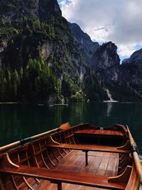 Scenic view of lake by mountains against sky