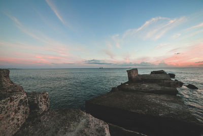 Scenic view of sea against sky at sunset