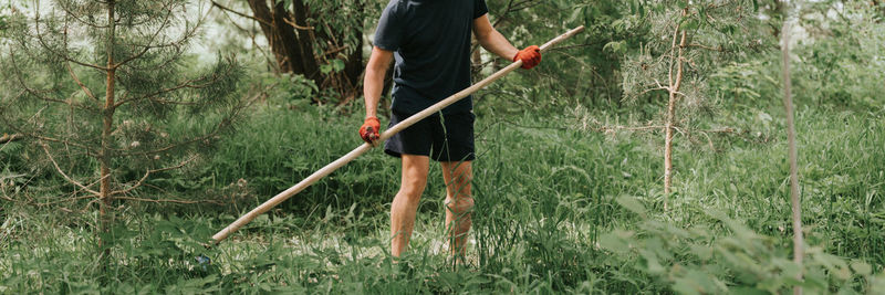 Rear view of man standing on field