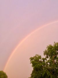 Low angle view of rainbow against sky