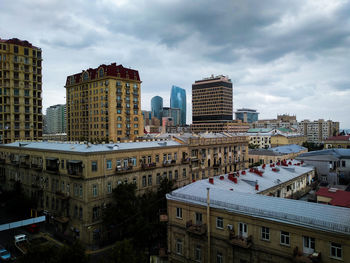 High angle view of buildings in city against sky.