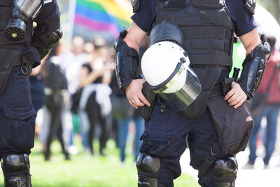 Midsection of police force during protest