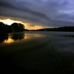 Scenic view of lake at sunset