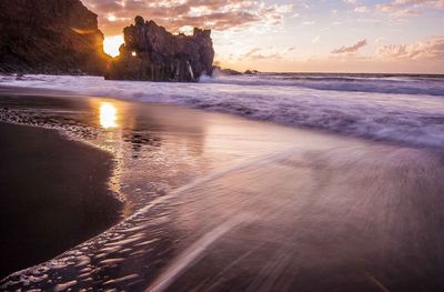 Scenic view of beach against sky during sunset tenerife