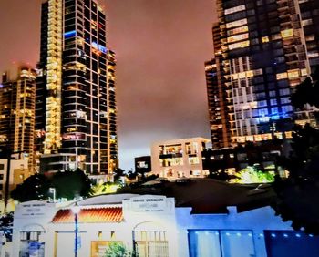 Illuminated buildings in city at night