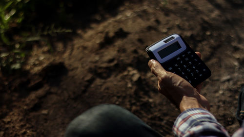 High angle view of person using mobile phone