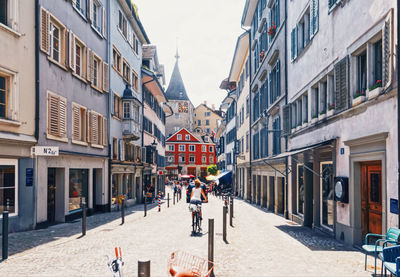 People walking on street in city