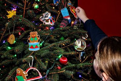 Midsection of illuminated christmas tree