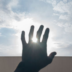 Sun seen through fingers