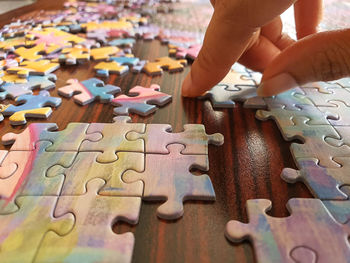 Midsection of man holding umbrella