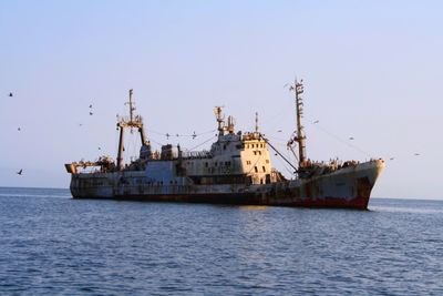 Ship in sea against sky