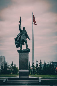 Low angle view of statue against sky during sunset