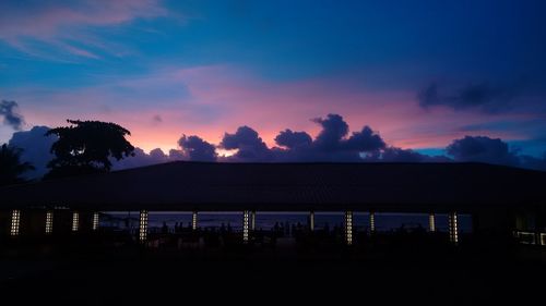 Silhouette of building at sunset