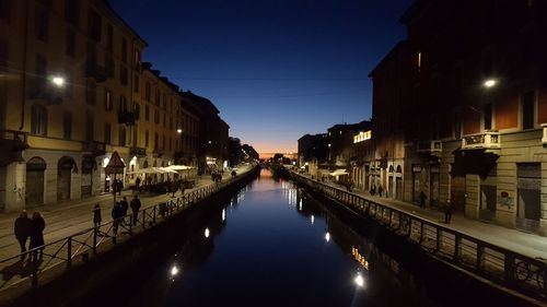 Reflection of illuminated buildings in water at night