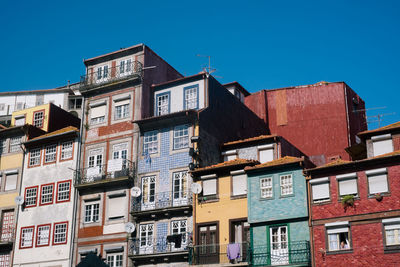 Low angle view of buildings against blue sky