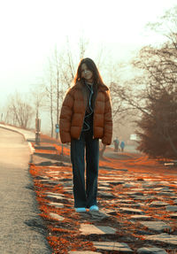 Portrait of a girl on the roadside in the mountains.