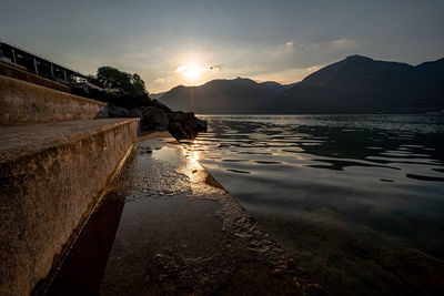 Scenic view of lake against sky during sunset