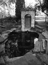 Reflection of buildings in puddle