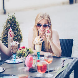 Portrait of young woman wearing sunglasses