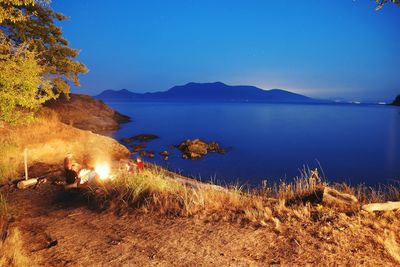 Scenic view of sea against sky at night