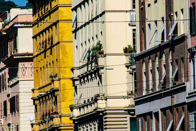 Low angle view of yellow buildings in city
