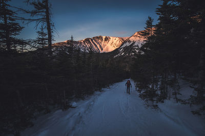 Scenic view of snow covered mountains against sky