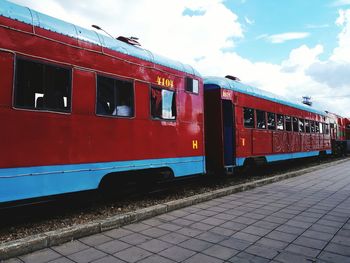 Train at railroad station against sky