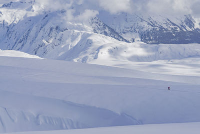 Scenic view of snowcapped mountain against sky