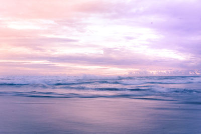 Scenic view of sea against sky at sunset