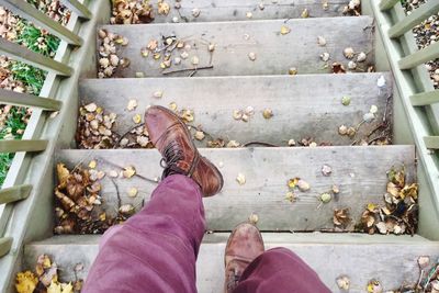 Low section of man standing on steps