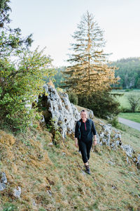 Full length of woman walking on grass