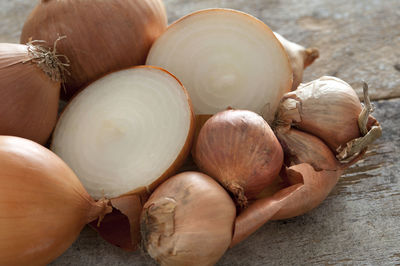 High angle view of onions on wooden table