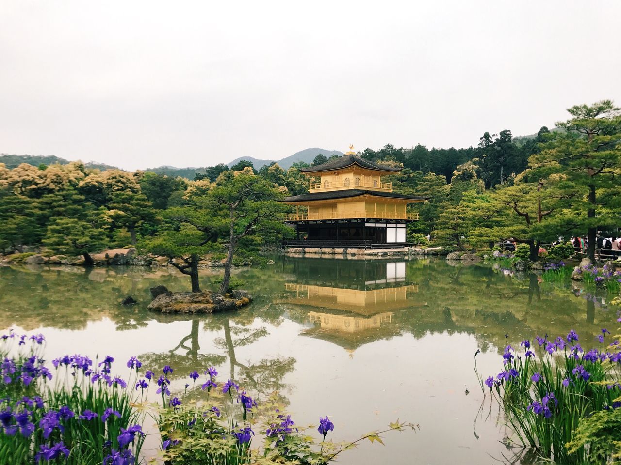 architecture, built structure, water, nature, beauty in nature, tree, day, reflection, growth, plant, outdoors, building exterior, lake, flower, scenics, sky, no people, mountain